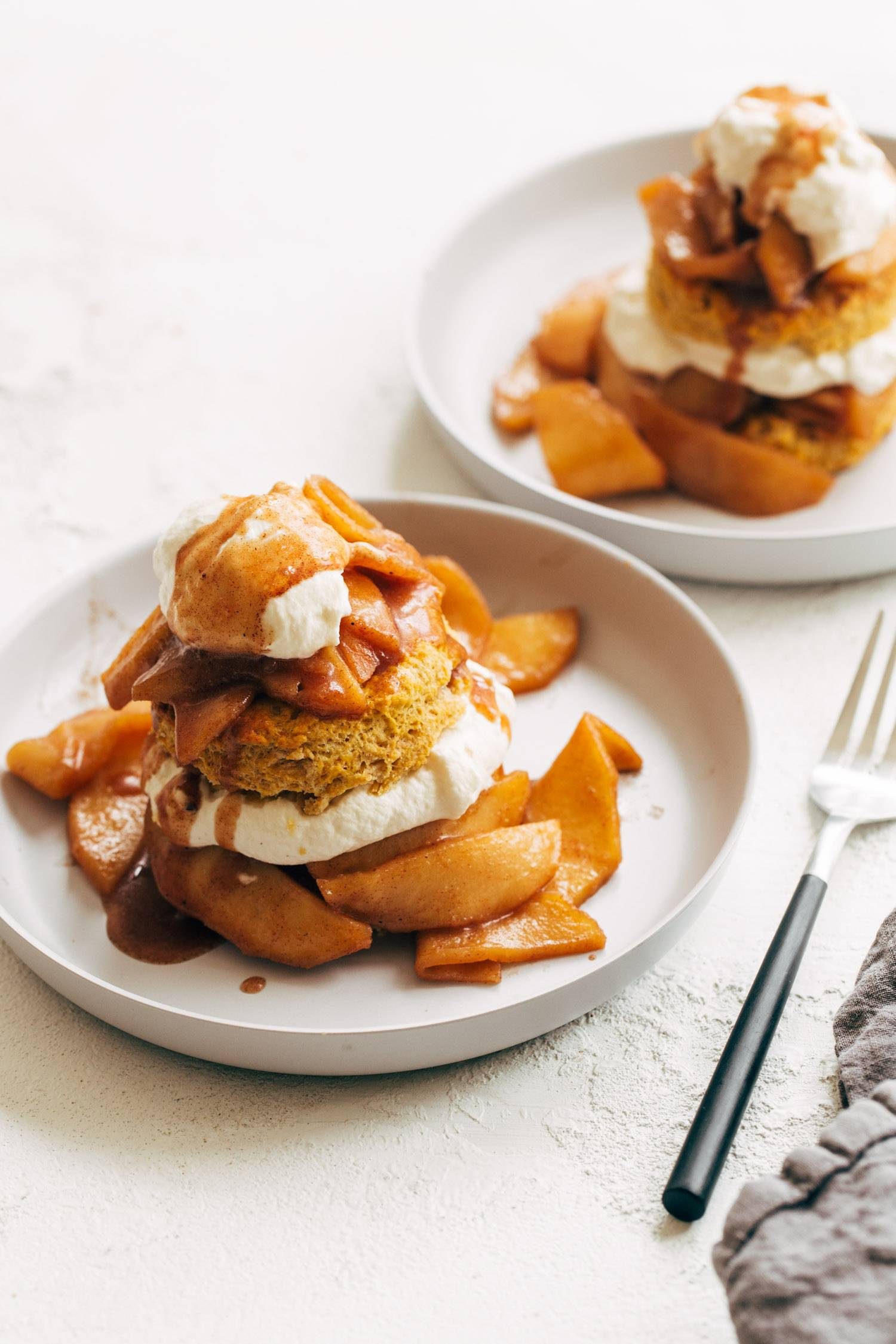 Pumpkin shortcakes on plates.