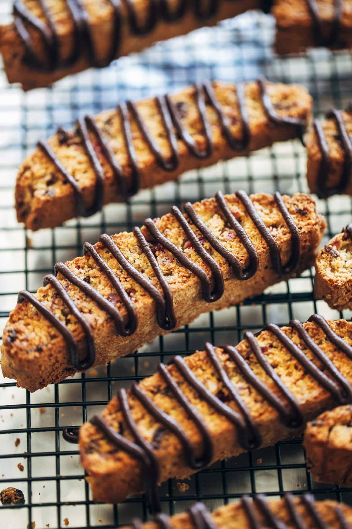 Cranberry Dark Chocolate Biscotti on a drying rack.
